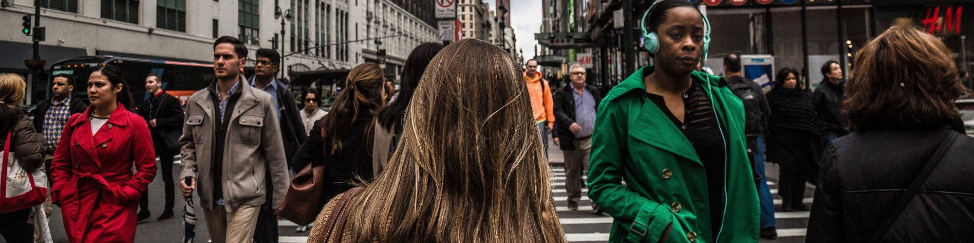 Crowd of people crossing the road in New York on their way to work